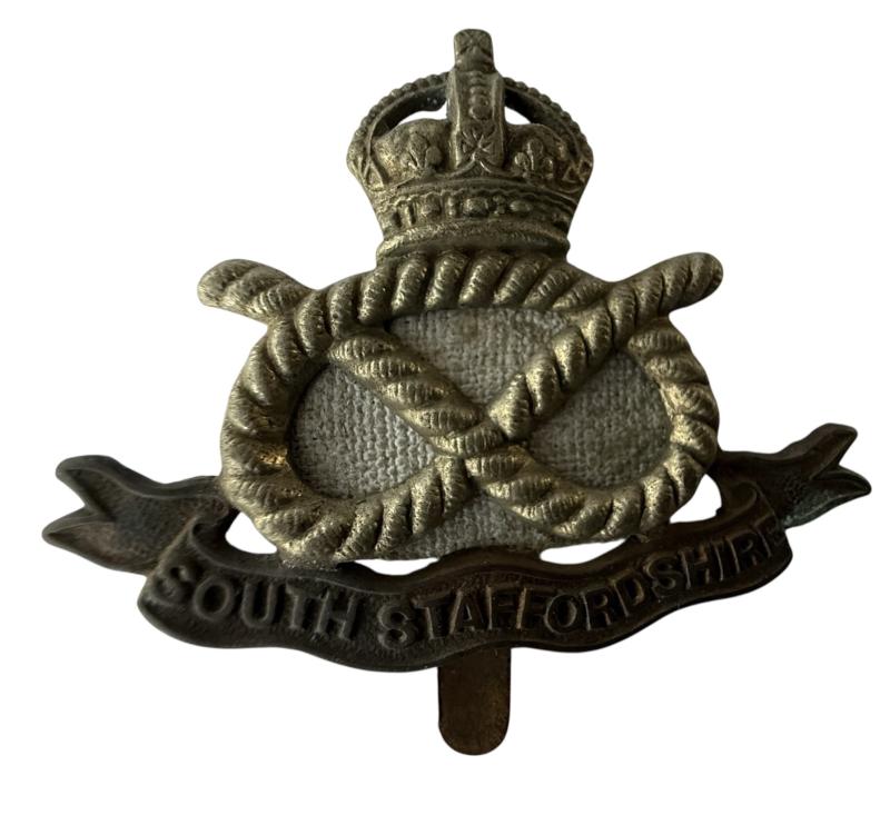 South Staffordshire Regiment cap badge with it's original 'HollandPatch' backing